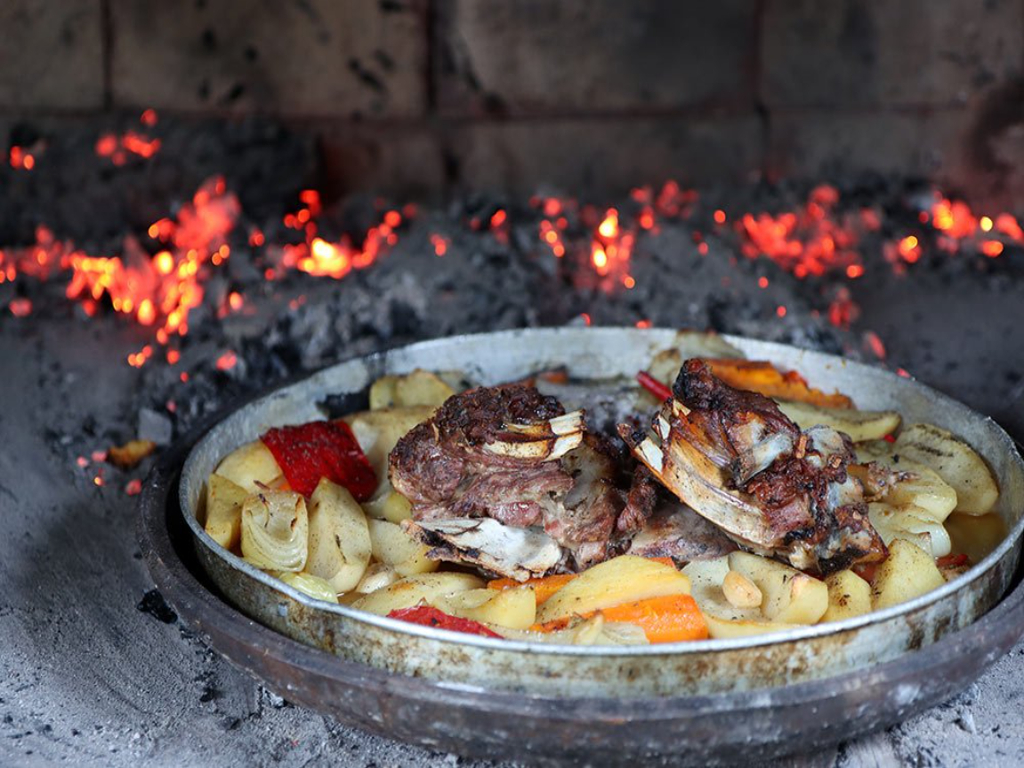 Traditional peka cooked under an iron bell